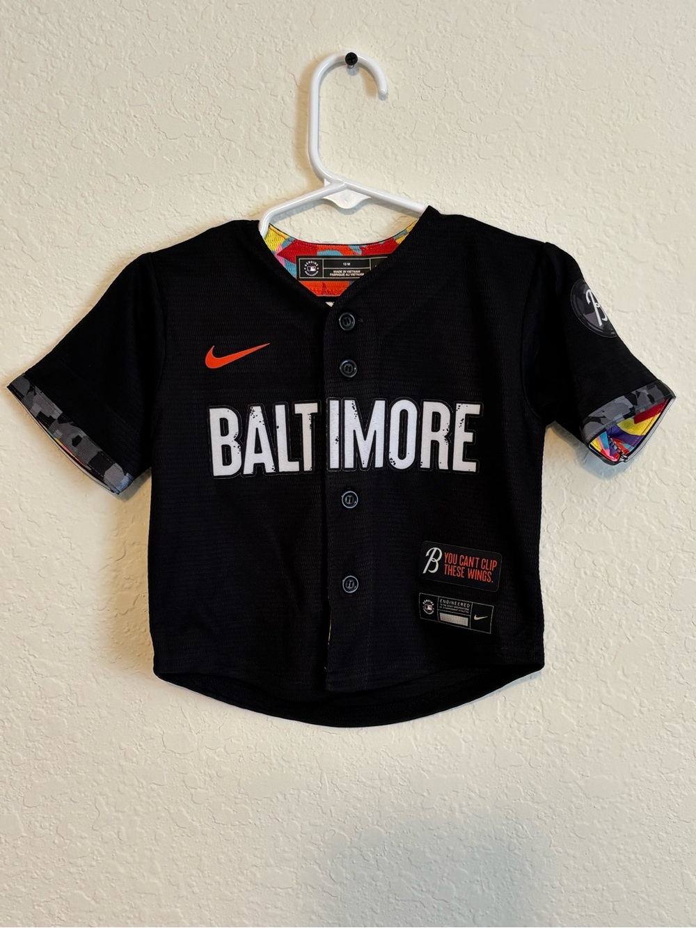 Nike Black Baltimore Kids Baseball Jersey with Orange Swoosh